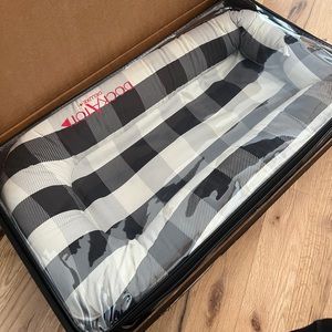 Black and white plaid DockAtot used 1 time (shown in plastic cover)